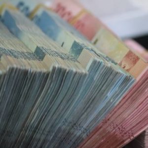 Nilai Tukar Rupiah Melemah ke Rp14.410 per Dolar AS, Apa Penyebabnya?