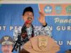 Bupati Banjar H Saidi Mansyur saat membacakan sambutan tertulis Menteri Pendidikan, Kebudayaan, Riset dan Teknologi Republik Indonesia, Nadiem Anwar Makarim, pada peringatan HUT ke-78 PGRI dan Hari Guru Nasional Tahun 2023, bertempat di Stadion Demang Lehman, Martapura, Sabtu (25/11/2023). (Foto: Kominfo Kabupaten Banjar/Koranbanjar.net)